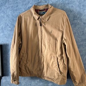 Men’s Polo jacket with full plaid lining size XL.  Full zip. Two front pockets.